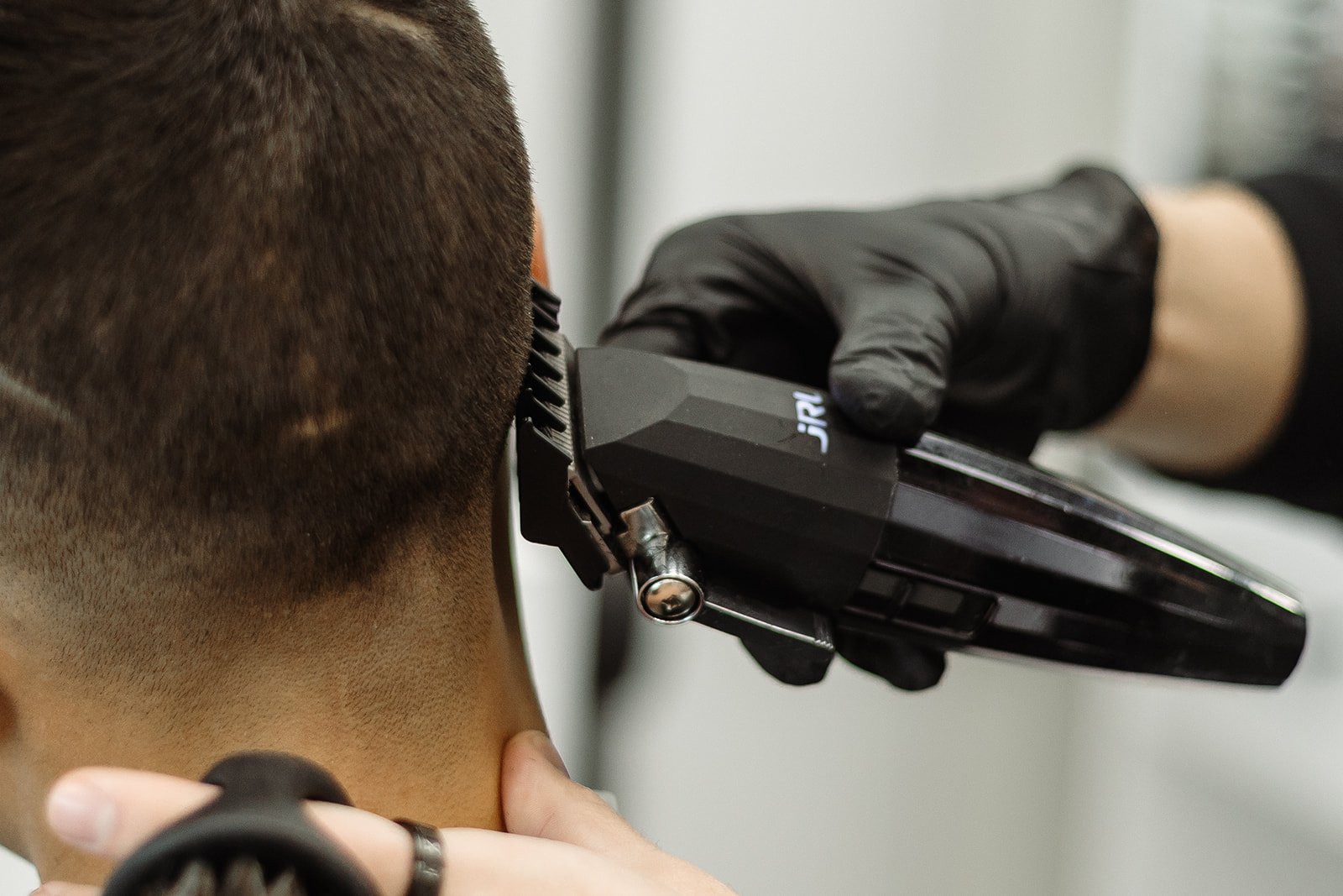 Close-up of JRL clipper detailing precision neckline fade