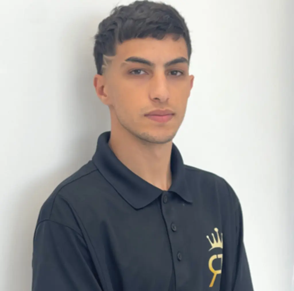 Ayham A. offering tailored haircuts with precision and creativity